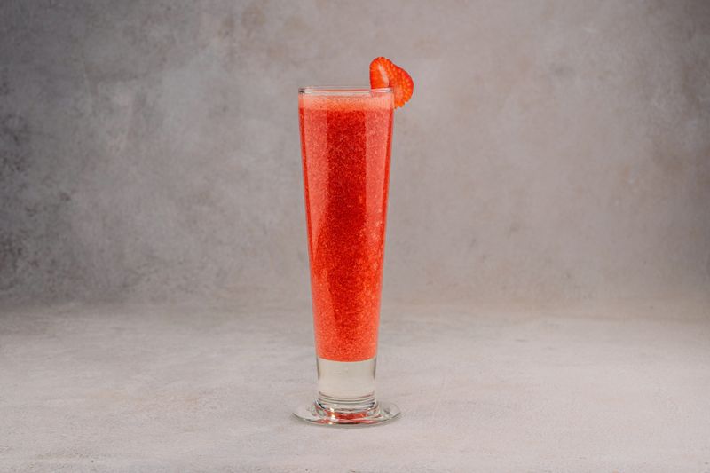 Strawberry hibiscus lemonade in a tall glass